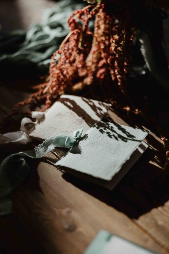 a detail shot of the bridal bouquet and two vow books for an elopement in the columbia river gorge
