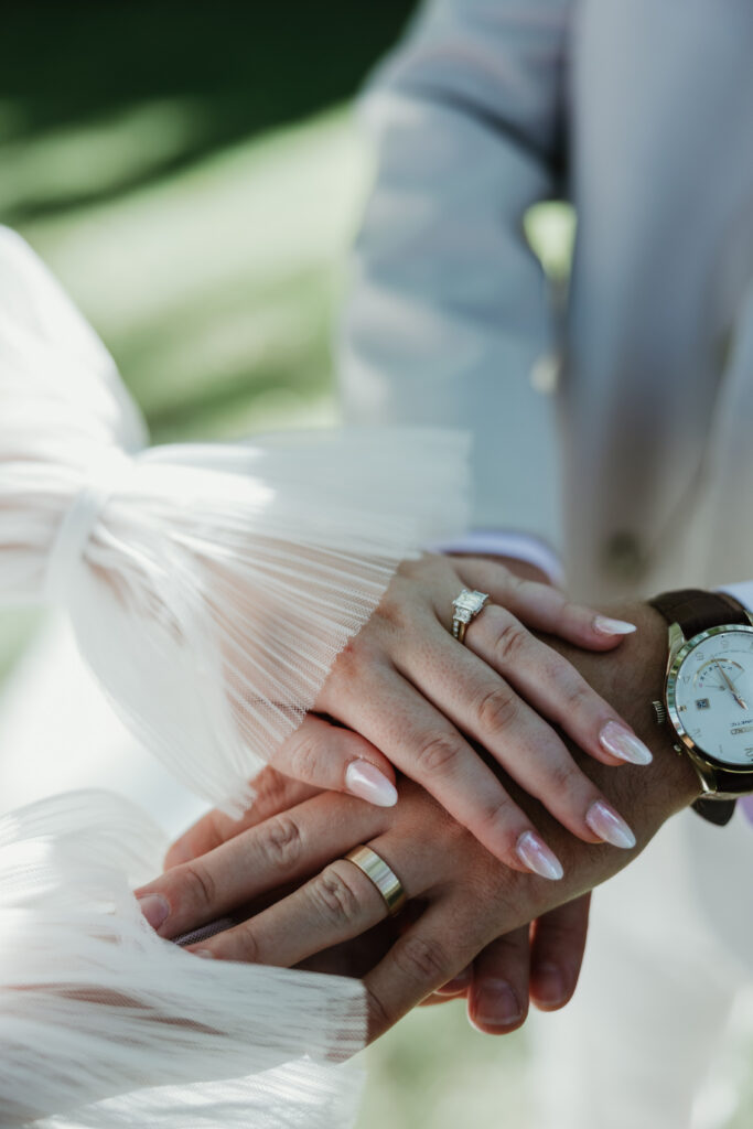 Ring detail shot with jewelry and watches during their outdoor Hillsboro Wedding