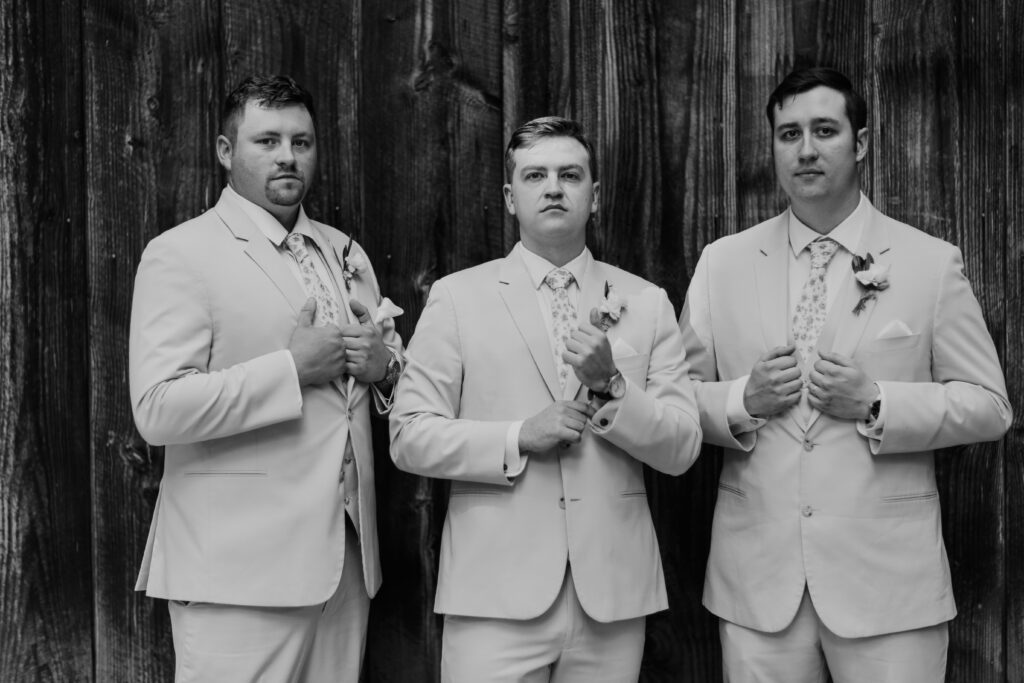 Groom and groomsmen getting ready in front of the Octagonal Barn at Mcmenamins Cornelius Pass Roadhouse