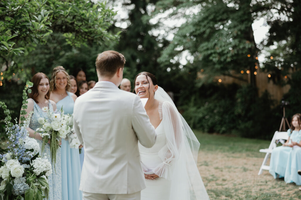 Groom reacting during outdoor garden ceremony in Hillsboro OR