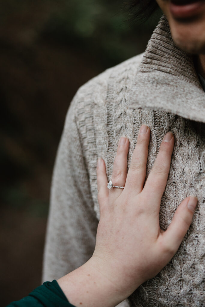 Close up of couple holding hands during Portland OR engagement session