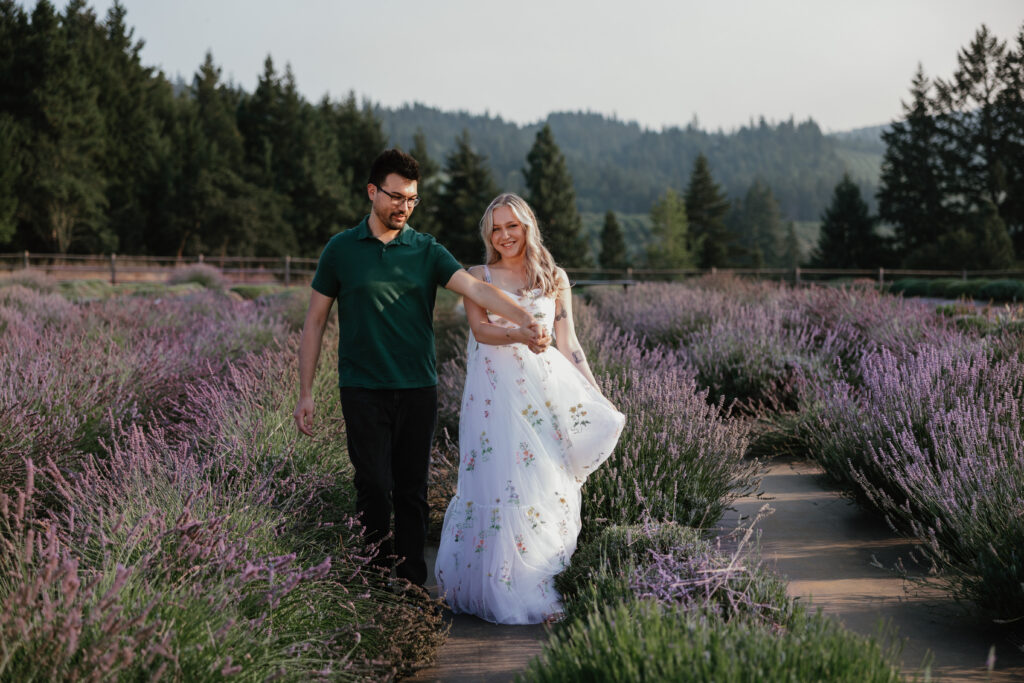 Olivia and Quinton standing in blooming lavender fields at Hood River Lavender Farms with smoky Columbia River Gorge views — Hood River engagement photographer