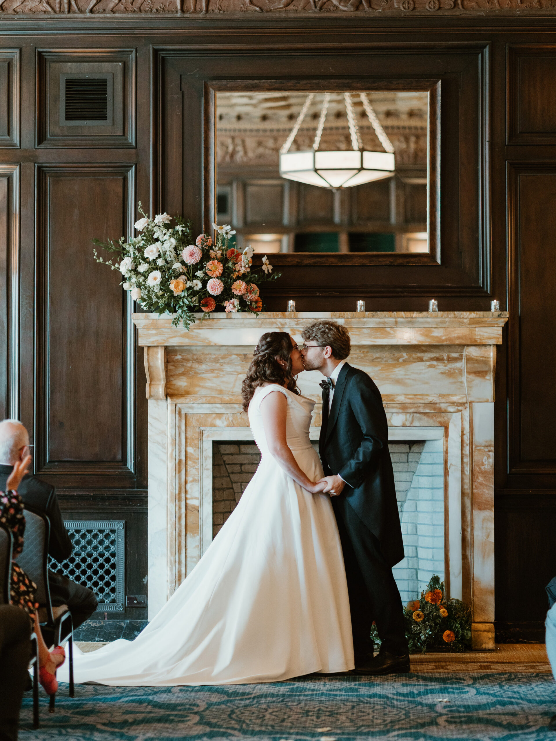 Bride and groom kiss at the altar in their Pacific Northwest Wedding Venue