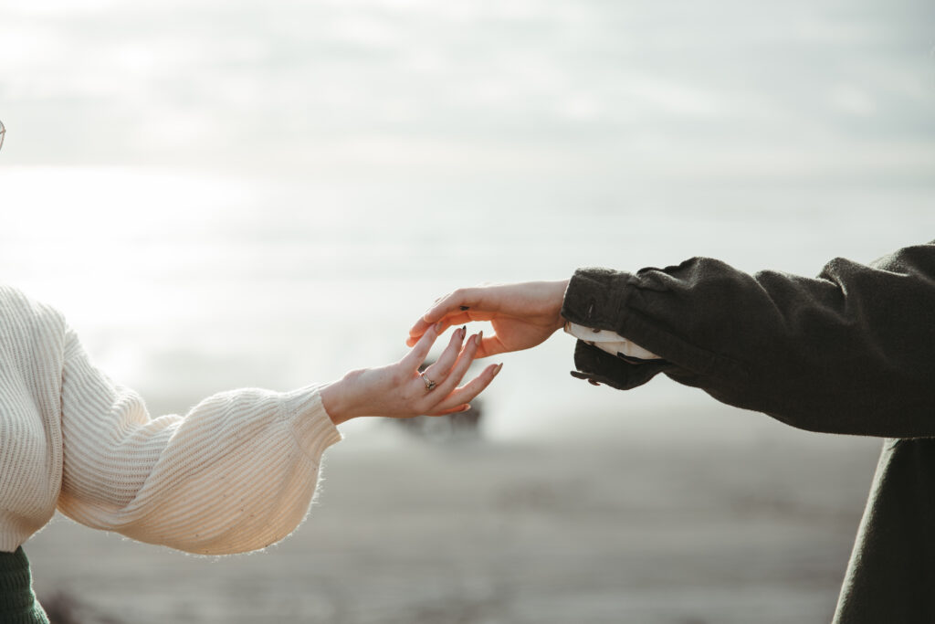 Romantic photo of engagement rings at the Oregon Coast