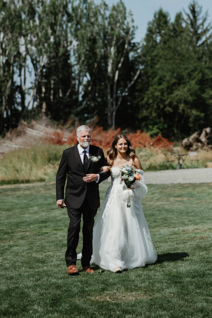 Bride walking down the aisle at outdoor ceremony at Mount Peak Farm Enumclaw Washington wedding