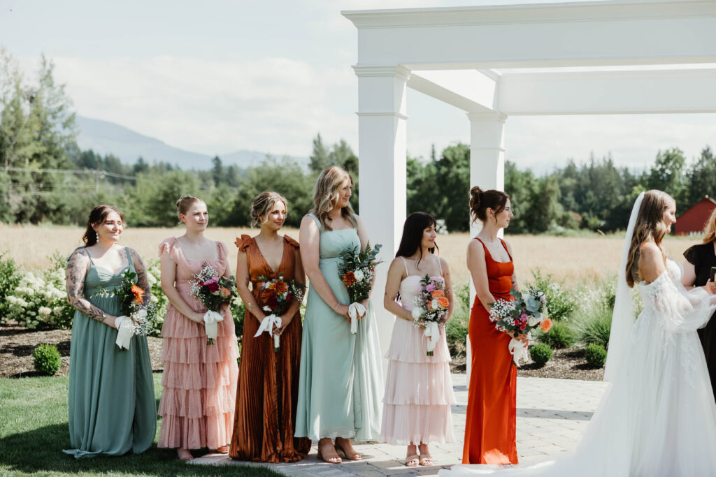 Overcast sky breaking into sunshine during wedding ceremony at Mount Peak Farm Enumclaw Washington