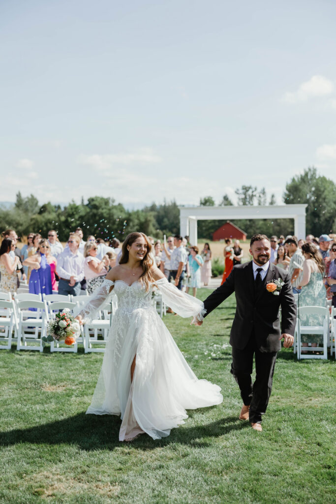Guests celebrating during wedding ceremony at Mount Peak Farm Enumclaw Washington