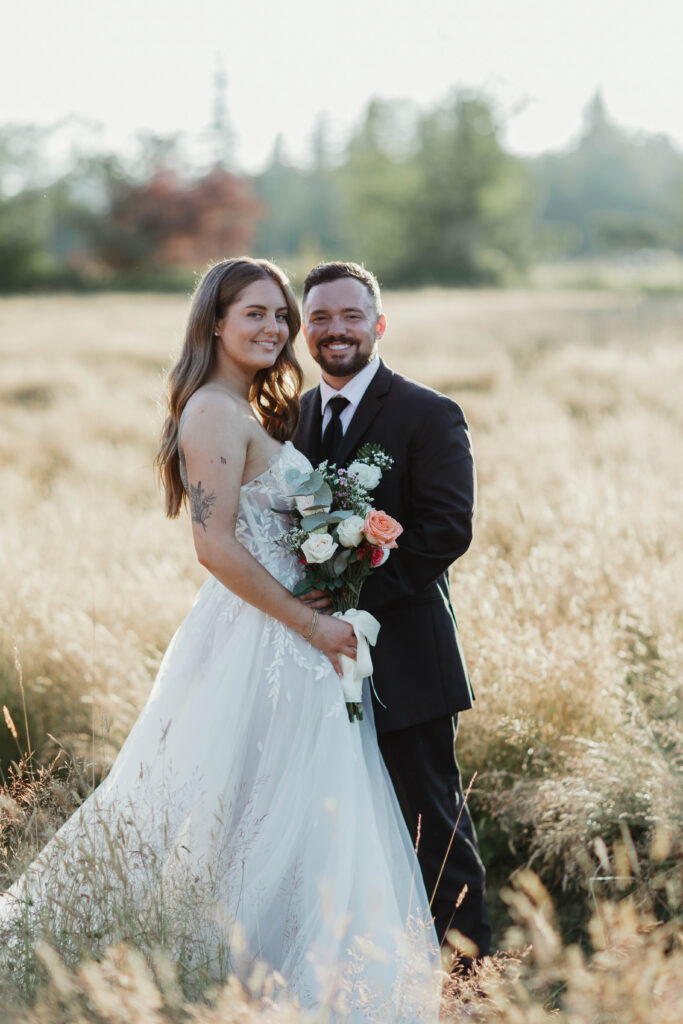 Couple silhouetted against golden hour sunset at Mount Peak Farm Enumclaw Washington wedding