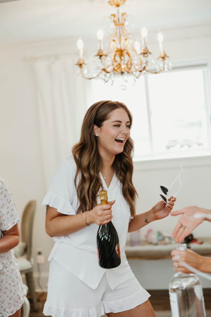 Bride smiling with bridesmaids during getting ready photos at Mount Peak Farm Washington state wedding