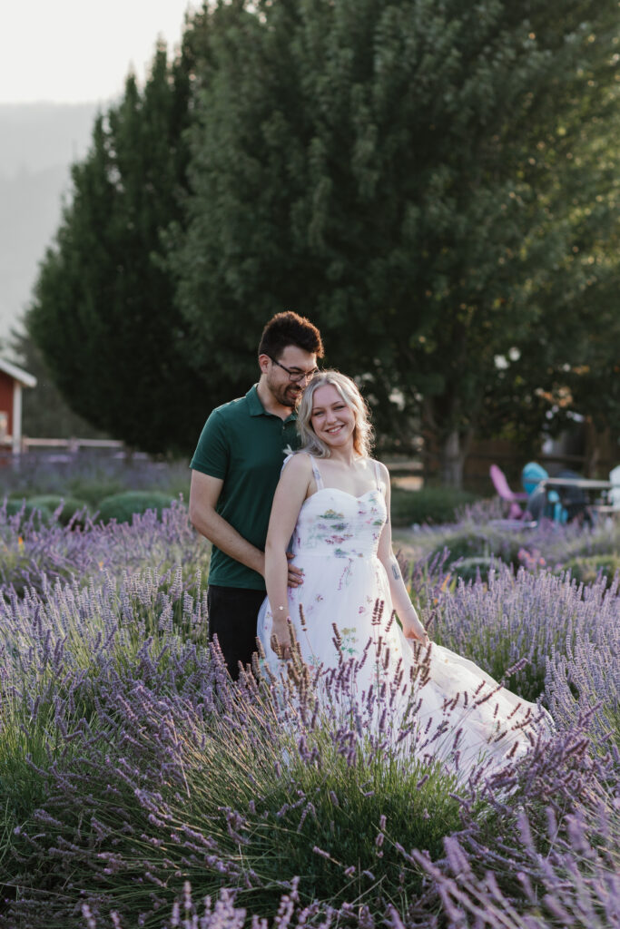 Olivia and Quinton laughing together in lavender fields at Hood River Lavender Farms — candid Columbia River Gorge engagement session