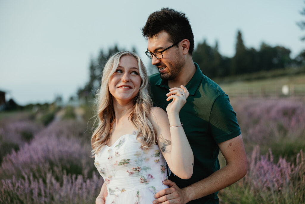 Couple strolling through blooming lavender fields in Hood River Oregon on a smoky summer evening — Hood River engagement photographer
