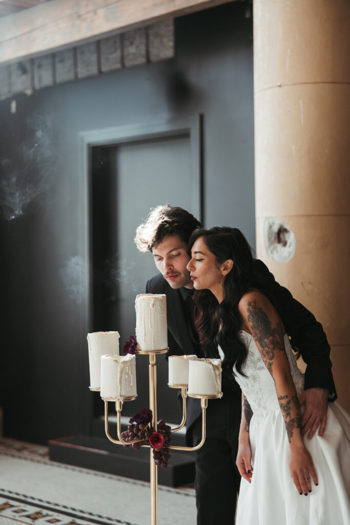 Wedding cake cutting at intimate alternative reception inside a historic Oregon ballroom