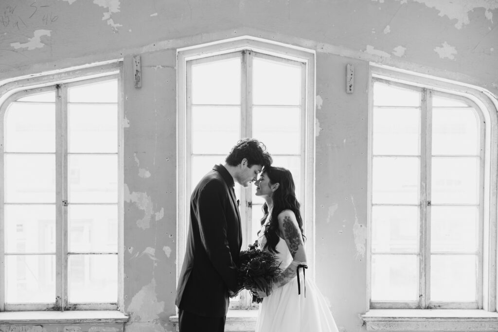 Couple sharing first kiss at intimate alternative wedding ceremony in Astoria Oregon