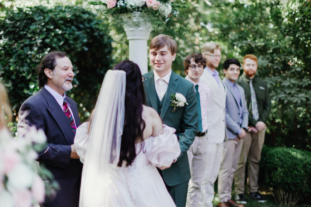 Groom's emotional reaction seeing his bride during the outdoor garden ceremony at Deepwood Salem OR