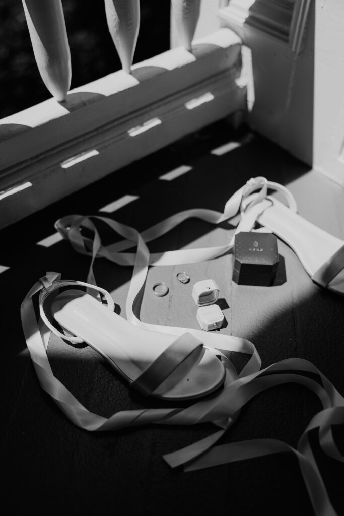 Wedding invitation suite flatlay with florals, rings, and ribbon details — Salem Oregon wedding photographer