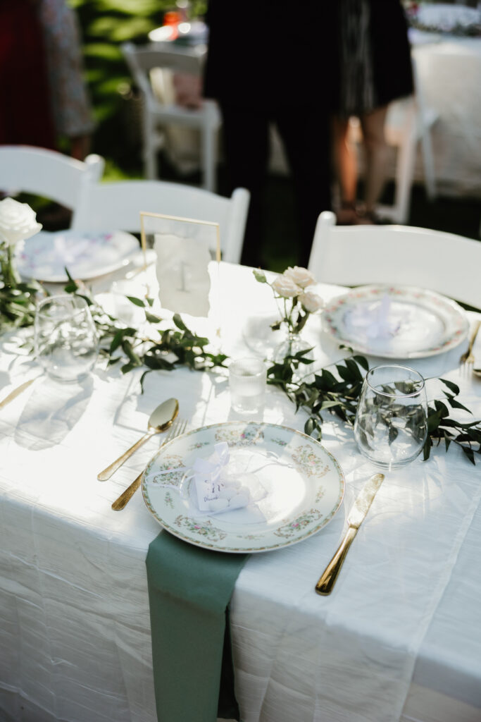 Elegant silverware and plates at a summer garden party wedding in Salem Oregon