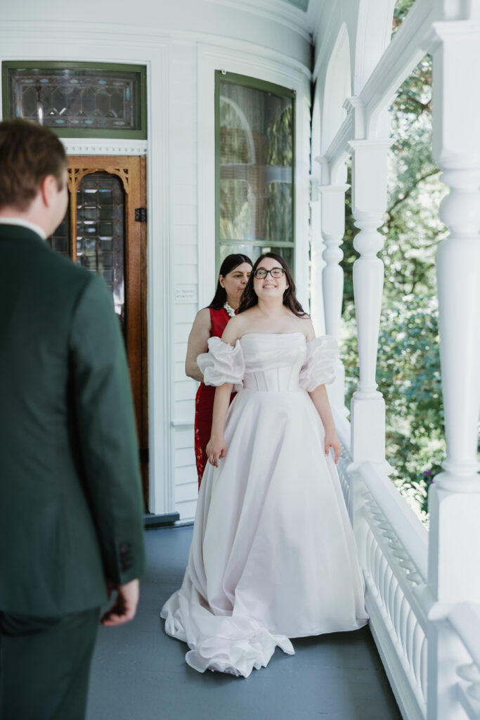 Groom seeing the bride for the first time on their wedding day at Deepwood Museum and Gardens in Salem, Oregon