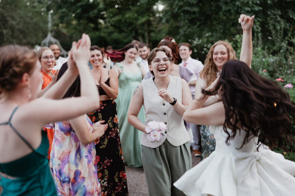 Bride and groom and wedding guests dancing at a summer garden wedding reception at Deepwood Museum and Gardens Salem Oregon