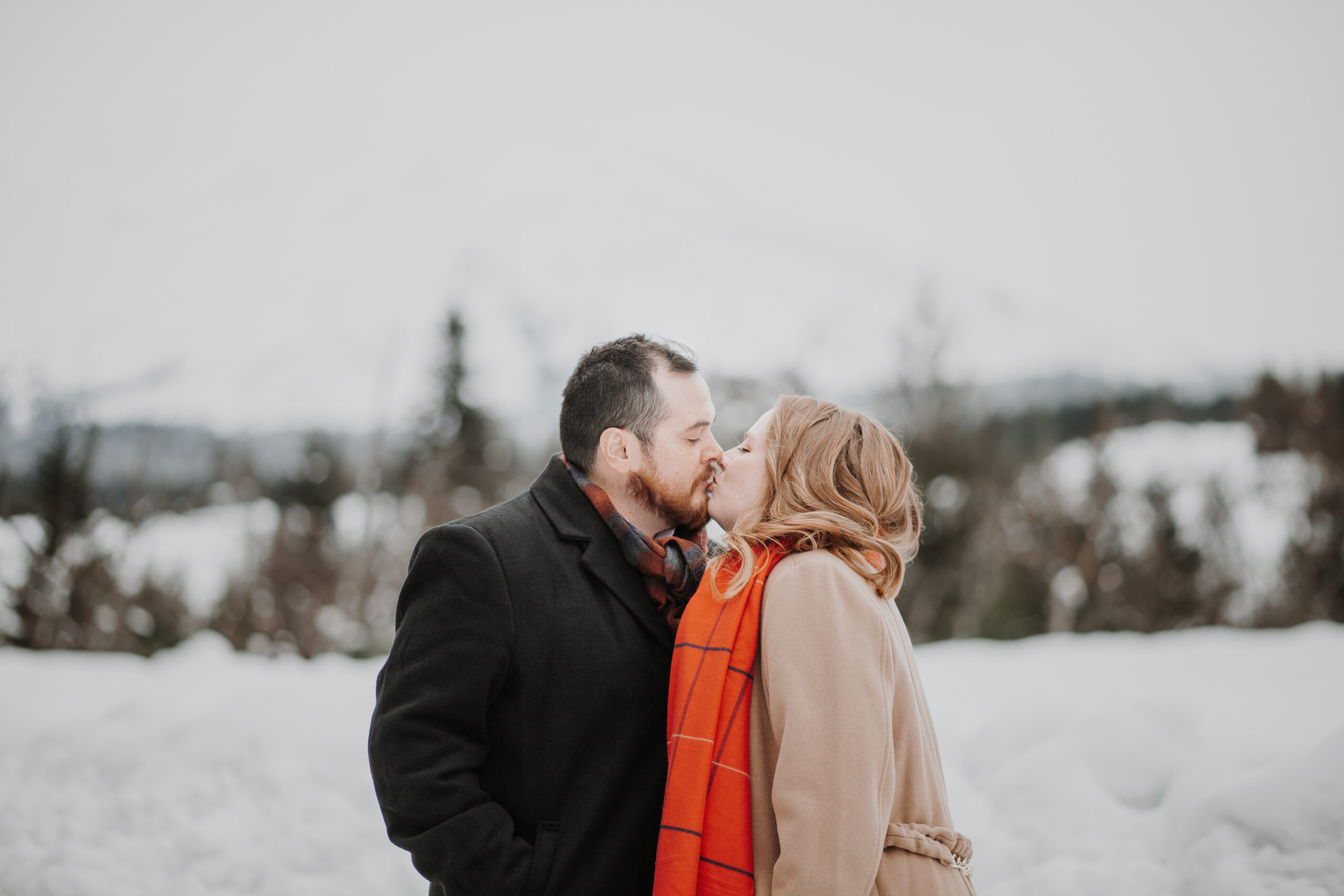 snowy engagement session up at mt. st. helens with the mountain in the background